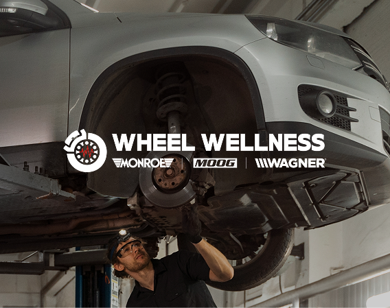 Wheel Wellness by Monroe, MOOG and Wagner — technician inspecting a vehicle's wheel and suspension