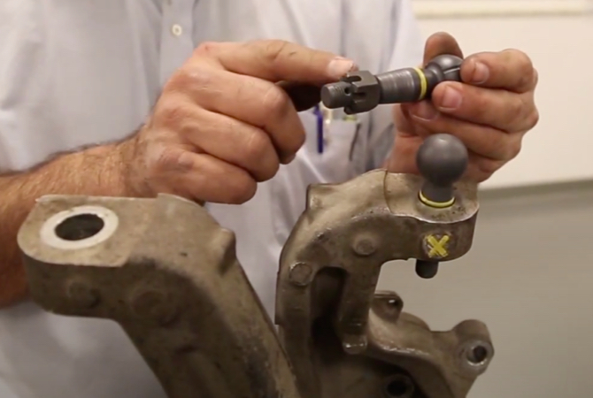 Ball joint with castle nut going past cotter pin hole.