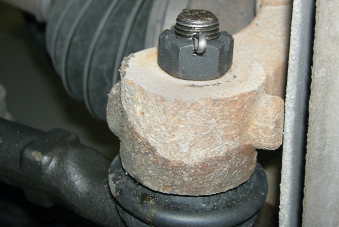 Castle nut on ball joint.