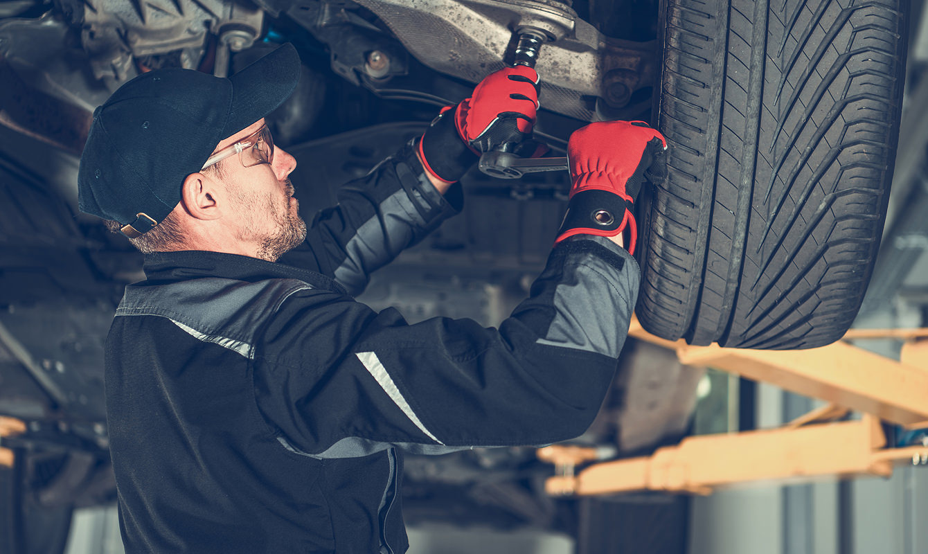 Mechanic-Working-On-Car-Suspension-System